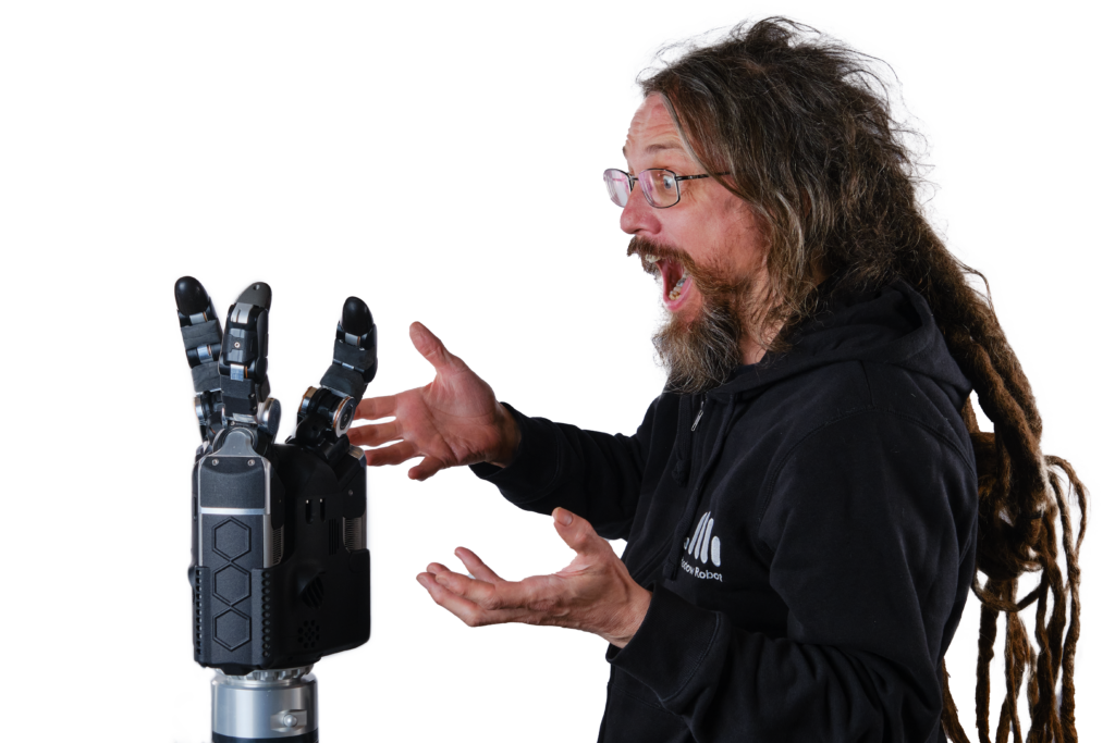 Rich Walker looking surprised and excited with the new Shadow Robot Hand