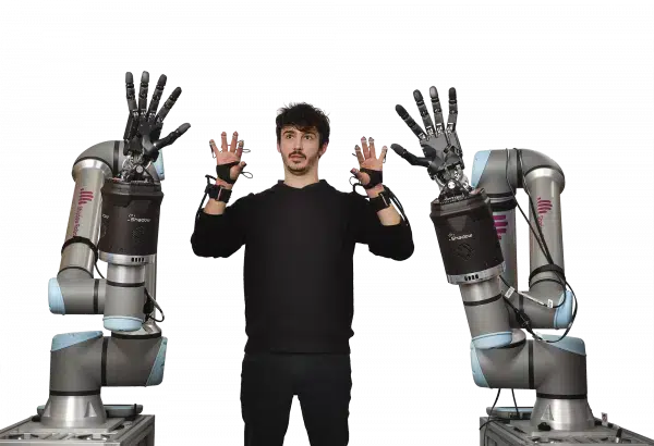 Picture showing two robot arms being controlled by a man wearing the Shadow Glove